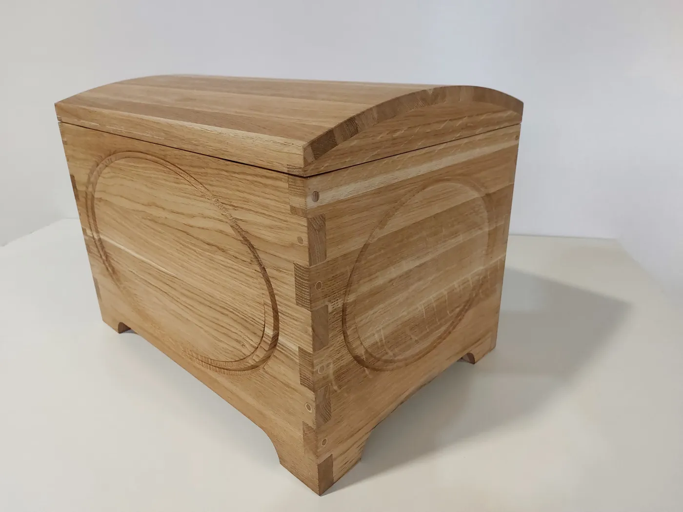 Domed oak chest, dovetailed corners