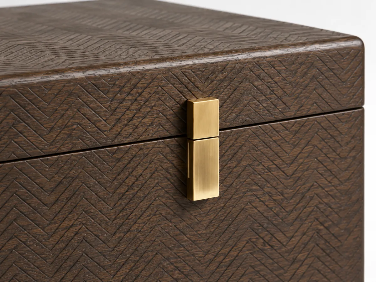 Close-up of a fine herringbone texture on dark-stained oak beside a brass latch plate — AI concept