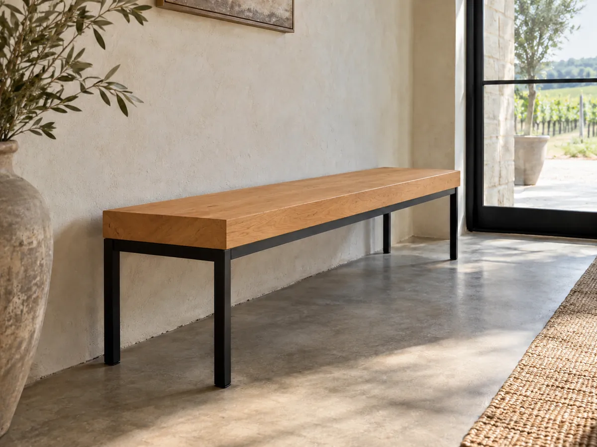 Bench with a warm reddish-brown black alder seat on a slim black steel frame — AI concept