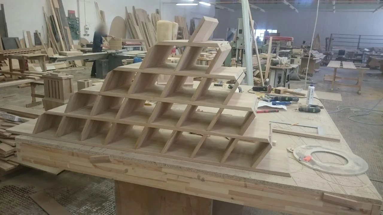 Pyramid wine rack taking shape on a workbench in our workshop