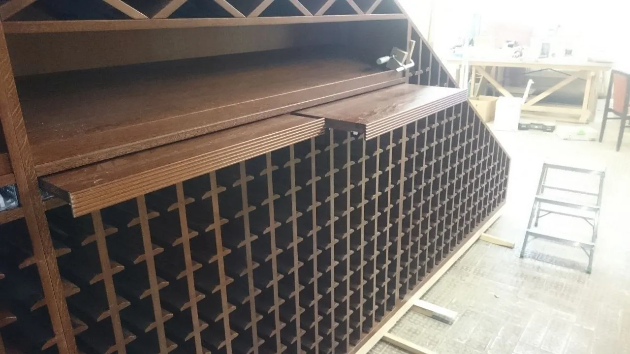 Pull-out shelves built into the top of the under-stair rack