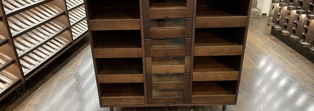 Central island with open shelves and glass-front drawers