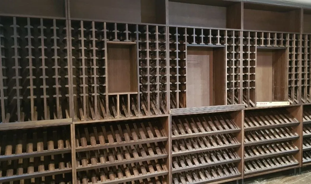 Racking wall with display niches, before the shop was stocked