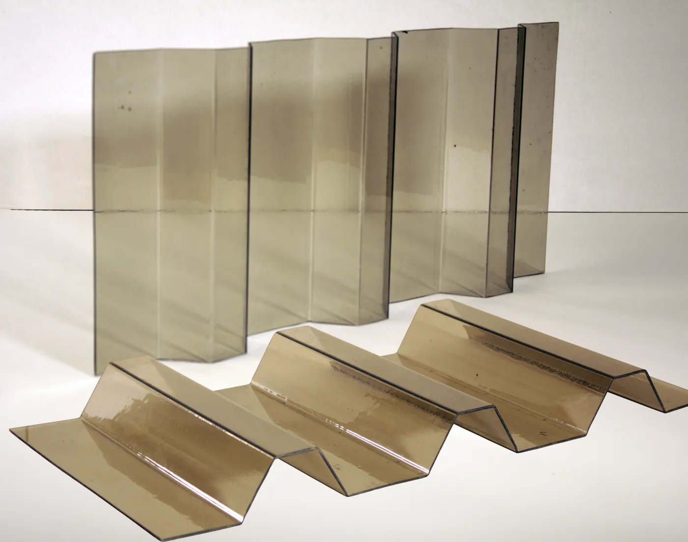 Smoked tinted plastic sheets bent into zigzag profiles