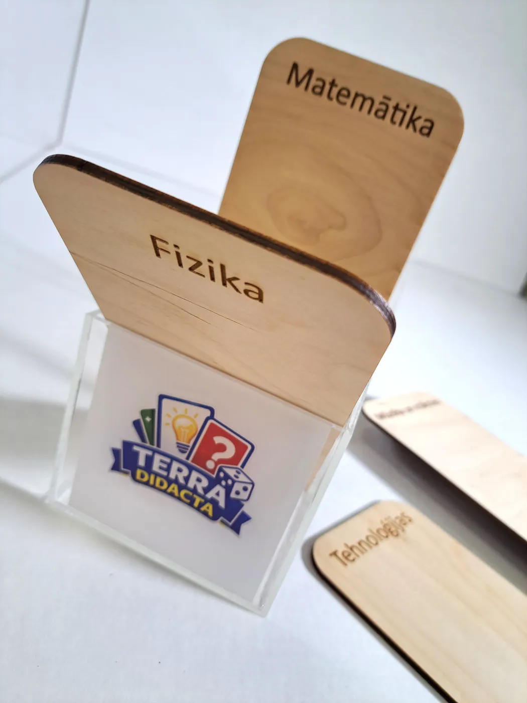 Clear acrylic card box with a printed logo and plywood tabs engraved with school subjects