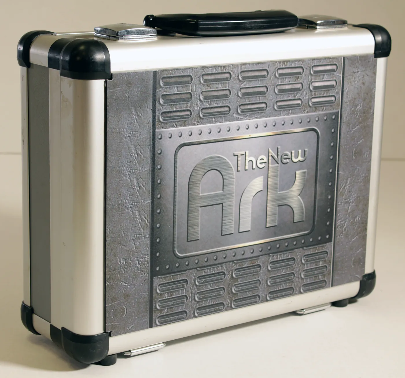 Metal-edged case with a riveted-look printed front and a printed name panel