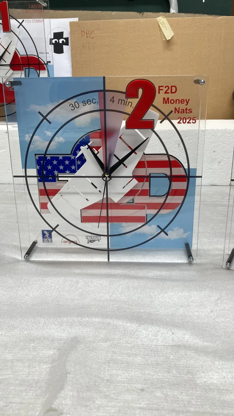 The second-place clock trophy from the same set, with a raised red number two